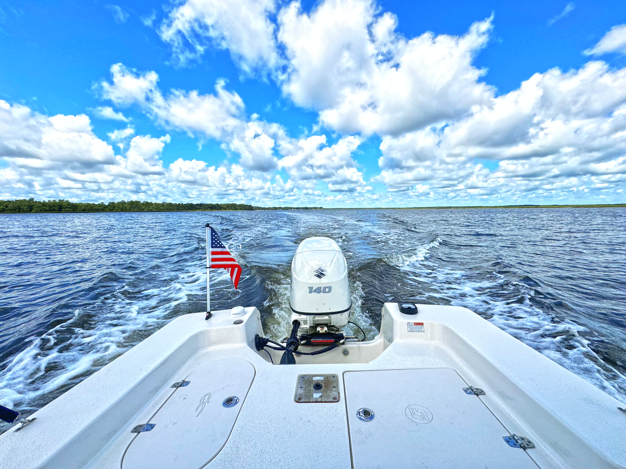 a boat with a flag on the front